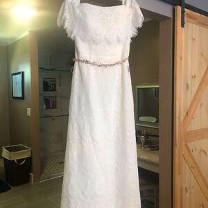 Still has tags on it! Never worn David’s bridal wedding gown!